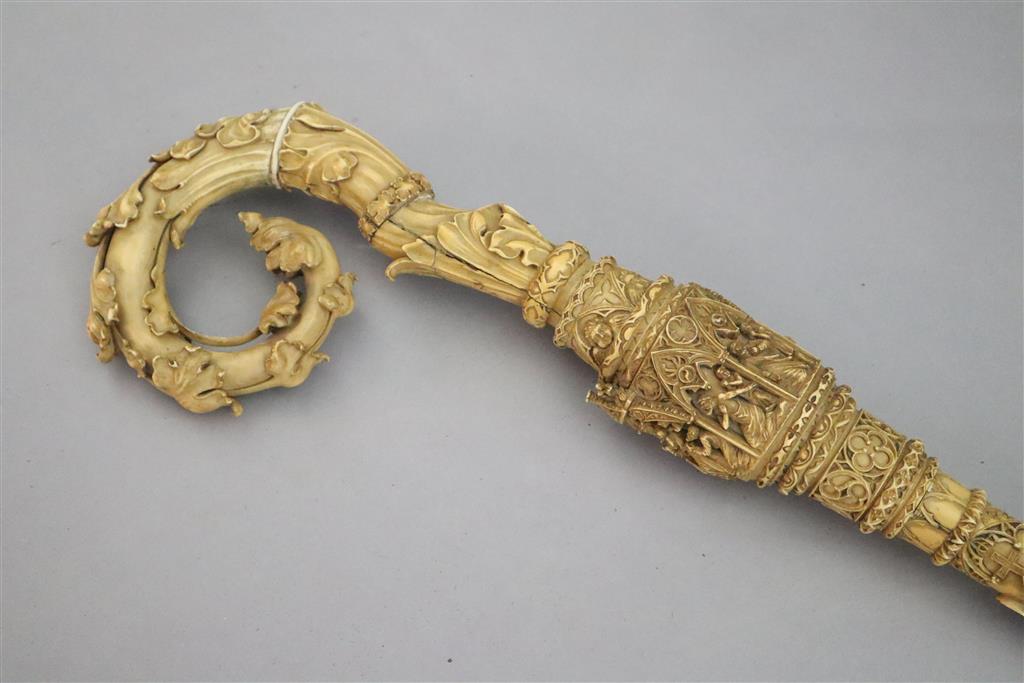 A 19th century Dieppe carved ivory crozier, thought to be a copy of a 13th century example, length 46in.